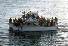 Two boats sailing during the Mariel Boatlift. Two boats during Mariel Boatlift (7164184055) (cropped).jpg