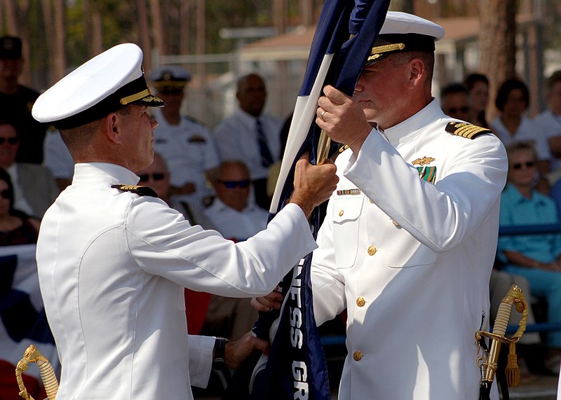 File:US Navy 060524-N-0553R-002 Commander, Construction Battalion Center, 20th Seabee Readiness Group, Capt. George E. Eichert transfers the command colors to on-coming skipper Capt. H.V. Dobson during a change of command ceremony.jpg