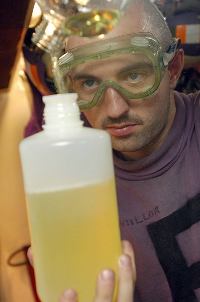 File:US Navy 060630-N-3946H-088 Aviation Boatswain's Mate Fuels Airman Robert Keillor prepares a fuel sample for quality assurance.jpg