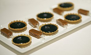 Violet tartlets and apple-pie toffee wrapped in edible sweet-paper