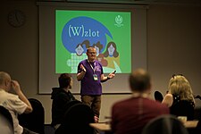 WMPL president welcoming Wikipedians at the start of the conference