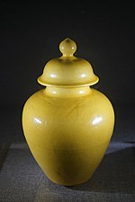 Yellow glazed pot and cover with hidden streak designs from the official kiln. Jiajing era. Excavated from Dadao tomb, Huangzhou. Yellow glazed pot and cover with hidden streak designs.jpg