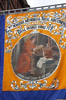 Martin Luther studying the Bible on the banner of the Grand Orange Lodge of Ireland. 12 July in Belfast, 2011 (158).JPG