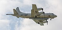 A P-3C Orion, tail number 161588, on final approach to Kadena Air Base in Okinawa, Japan. It has an AN/APS-149 Littoral Surveillance Radar System (LSRS) mounted underneath it.