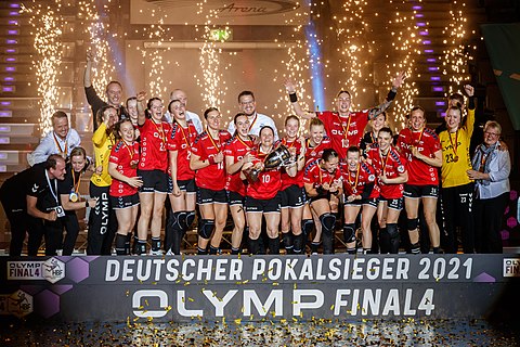 Handball Women, OLYMP Final4 2021: SG BBM Bietigheim celebrate their first victory in German handball cup; gold medal; award ceremony