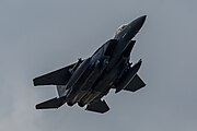 An F-15E Strike Eagle, tail number 97-0218, taking off from RAF Lakenheath in England. The aircraft is assigned to the 492nd Fighter Squadron.