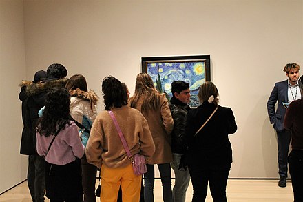 Visitors viewing Van Gogh's The Starry Night in New York's Museum of Modern Art
