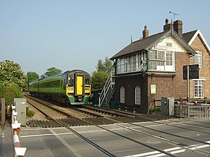 Derby to Stoke train at Sudbury level crossing - geograph.org.uk - 462738.jpg