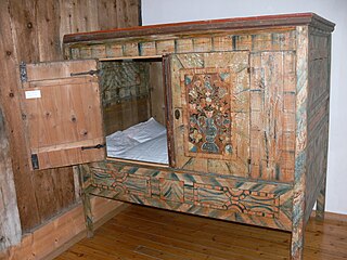 Box-bed Enclosed bed generally designed for sleeping in a sitting position, whereby it can be closed with doors or curtains