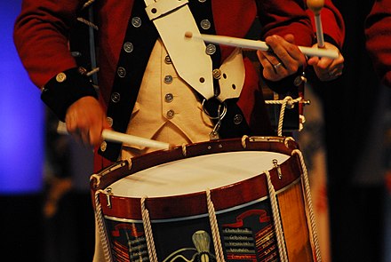 A drummer of the Old Guard Fife and Drum Corps with a Snare Drum