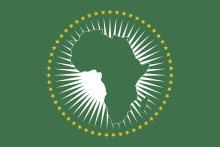 Flag of the African Union. Green shape of the African continent set against radiating white lines and circled with 55 gold stars representing the member states.