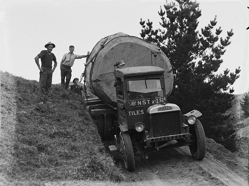 File:Front on view of a Leyland truck transporting a piece of Kauri along a dirt road (AM 75779-1).jpg