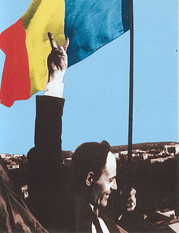 Deputy Gheorghe Ghimpu replaces the Soviet flag on the Parliament with the Romanian flag on 27 April 1990. Gheorghe Ghimpu arboreaza Tricolorul.jpg