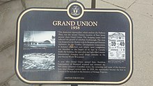 A commemorative plaque detailing the history of Grand Union. Grand Union, 1958 (Heritage Toronto 2014).jpg