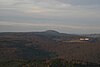 View from the observation tower on the Dreistelzberg to the north to the Großer Haube;  on the right the Volkersberg monastery (on the Kirchberg near Volkers)