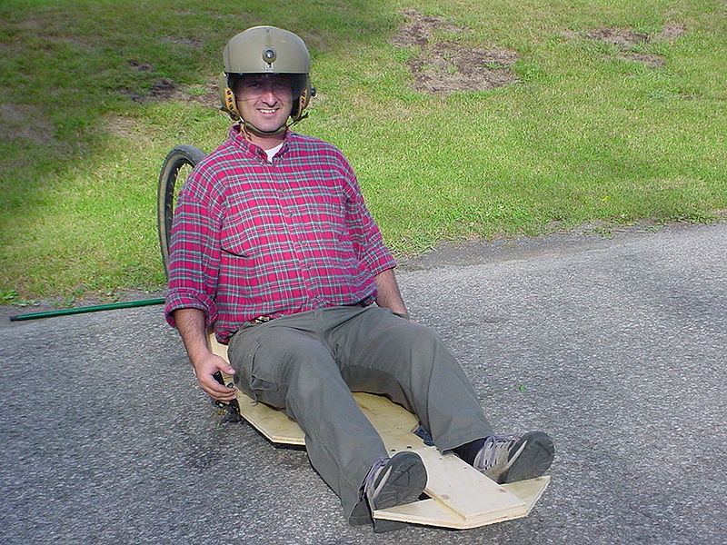 File:Homebuilt street luge with brakes and builder on board. (218169982).jpg