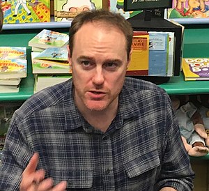 Riley at a book signing event in 2018