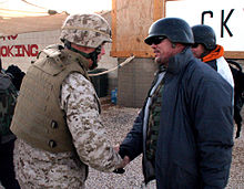 McMahon being greeted by the Commanding Officer of the 15th Marine Expeditionary Unit during his USO tour in Iraq in December 2006 Jim McMahon in Iraq with the 15th MEU.jpg