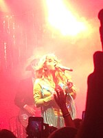 Kesha performing on tour with the Creepies in August 2016