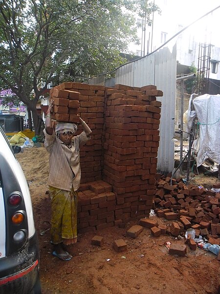 File:Lady with bricks 2.JPG