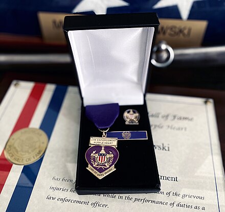 A Law Enforcement Purple Heart and Certificate issued by the National Association of Chiefs of Police
