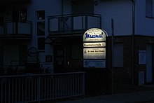 Illuminated sign of the Maximal Kulturinitiative at Eisenbahnstraße 13 in 63110 Rodgau