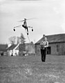 Model helicopter being controlled by its creator Arthur M. Young.jpg