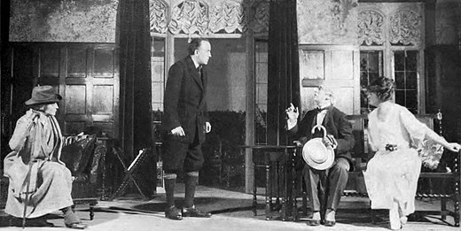 Digges (standing) in the 1921 Broadway production Mr. Pim Passes By, along with (from left) Helen Westley, Erskine Sanford, and Laura Hope Crews