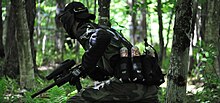 A player in the middle of a popular style of paintball known as "woodsball" NAdo.jpg