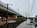 The nearly completed landscaping and the new rebuilt elevated railway, July 2024