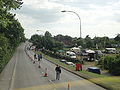 Fairlee Road, Newport, Isle of Wight photographed during the Isle of Wight Festival 2010. As can be seen, the road has been restricted to only allow traffic towards Newport due high pedestrian numbers walking towards the Festival site over the weekend, causing buses and other vehicles to be diverted along other roads. After the end of each act on the night the road is closed in both directions.