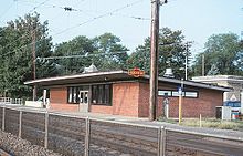 Odenton station in 1995, with PRR sign on the station house Odenton station building, August 1995.jpg