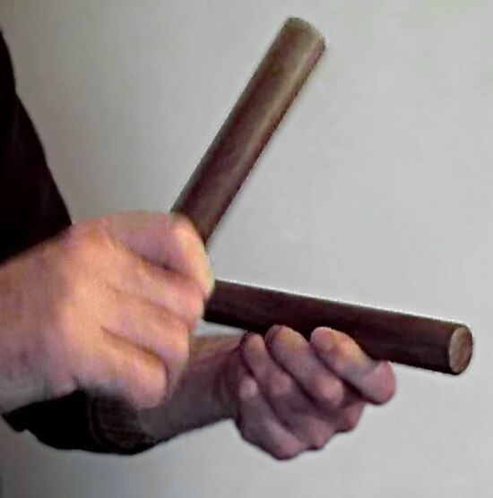 Playing a pair of claves