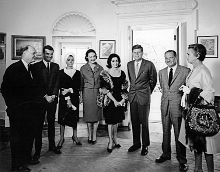 Lawrence (center) next to John F. Kennedy at the White House, two days before Kennedy's assassination