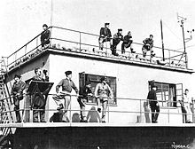 The control tower at RAF Metfield, on 30 May 1944, AAF personnel waiting for returning aircraft. RAF Metfield - Control Tower.jpg