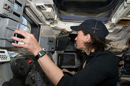 McArthur, STS-125 mission specialist, works the controls of the remote manipulator system (RMS) on the aft flight deck of the Earth-orbiting Space Shuttle Atlantis during flight day eight activities.
