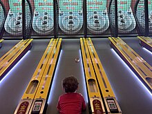 Young child playing skee-ball at Fantasy Island on Long Beach Island, New Jersey, 2023 Skeeball.jpg