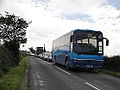 Southern Vectis 7090 (934 BDL, originally GX02 ATF), a Volvo B12M/Plaxton Paragon, in Staplers Road, Newport, Isle of Wight. The bus had been caught up in traffic congestion caused during the Isle of Wight Festival 2012. It is seen without branding after the removal of the Moss Tours brand to make way for Vectis Blue.