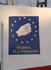 "Trumna dla rybakow" ("Coffin for fishermen"). A sign visible on the sides of many Polish fishing boats. It depicts an obscene Slavic gesture. Polish fishermen protest against the EU's prohibition of cod fishing on Polish ships. Trumna dla rybakow2.jpg