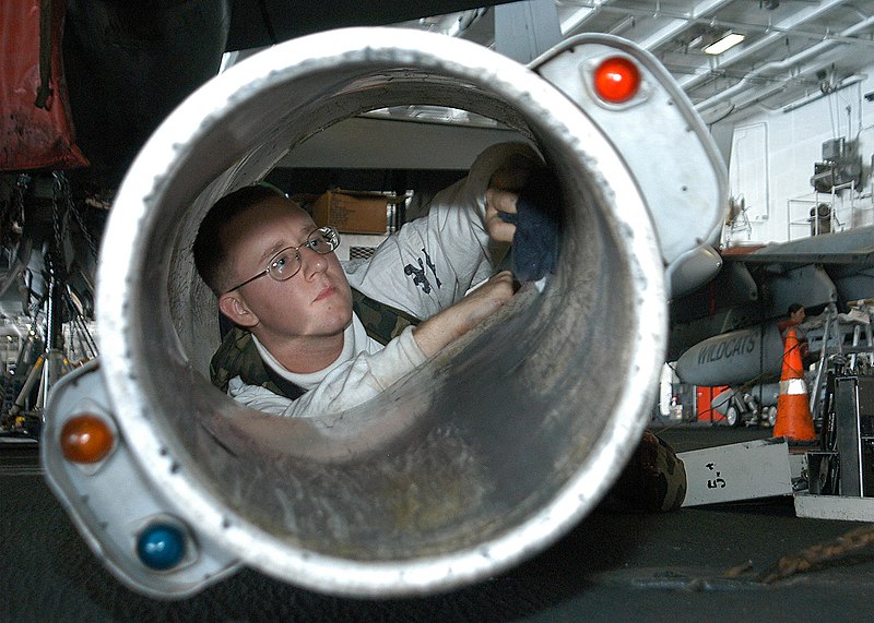 File:US Navy 040419-N-1522S-030 Aviation Machinist's Mate 3rd Class Alex Bodle, of Tucson, Ariz., cleans an air refueling buddy store unit tail cone prior to completing a Non-Destructive Inspection (NDI).jpg