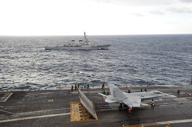 File:US Navy 101026-N-3418M-123 The aircraft carrier USS George Washington (CVN 73) conducts routine flight operations while the Arleigh Burke-class gui.jpg