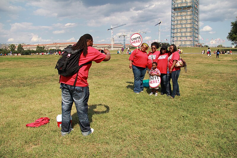 File:Unite Here - Photographer and group in red t shirts by Washington Monument - 50th Anniversary of the March on Washington for Jobs and Freedom.jpg