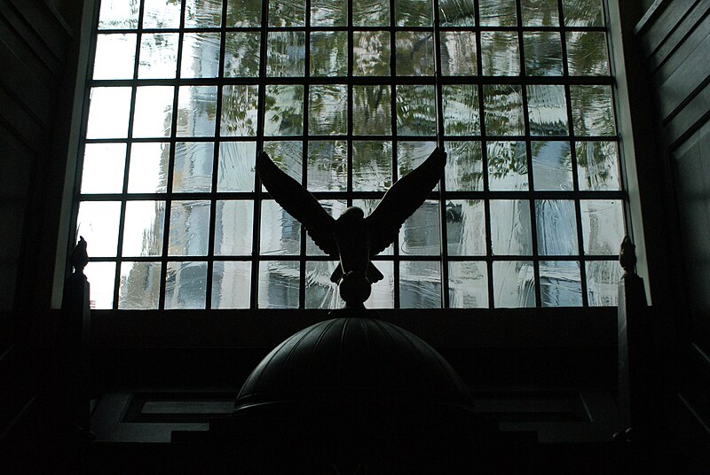 File:View of a small eagle statue above a display silhouetted against the window in St. Clement Danes Church - geograph.org.uk - 5164321.jpg