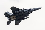 An F-15E Strike Eagle, tail number 91-0302, taking off from RAF Lakenheath in England. The aircraft is assigned to the 492nd Fighter Squadron.