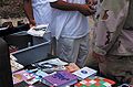 File:A Guantanamo captive looks through reading material.jpg