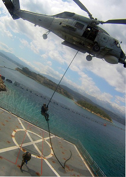 File:A member of an Algerian navy boarding team fast-ropes out of a Hellenic Navy S-70B-6 Aegean Hawk helicopter assigned to the 2nd Squadron onto the training ship Aris (A 74) at the NATO Maritime Interdiction 120517-N-QD416-196.jpg