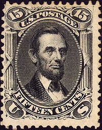 A 15 cent postage stamp depicting Lincoln with a beard.