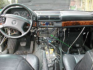 Heater core (arrowed) in the partially disassembled dashboard of a BMW E32. BMW E32 heater core.jpg