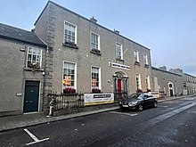 The Westport branch of the Bank of Ireland established in 1826 by George Clendining was one of the earliest branches of the bank outside Dublin. The Bank took the lease on this townhouse in 1851. The building is now the Credit Union. Bank of Ireland.jpg