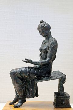 Bronze statuette of a young woman reading (latter 1st century) Bronze young girl reading CdM Paris.jpg